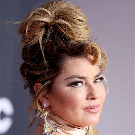 Shania Twain exposes bare chest in see